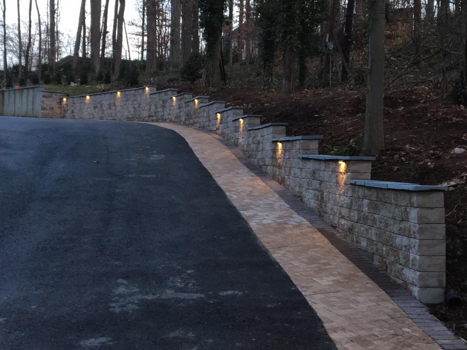 Driveway with lights on retaining wall